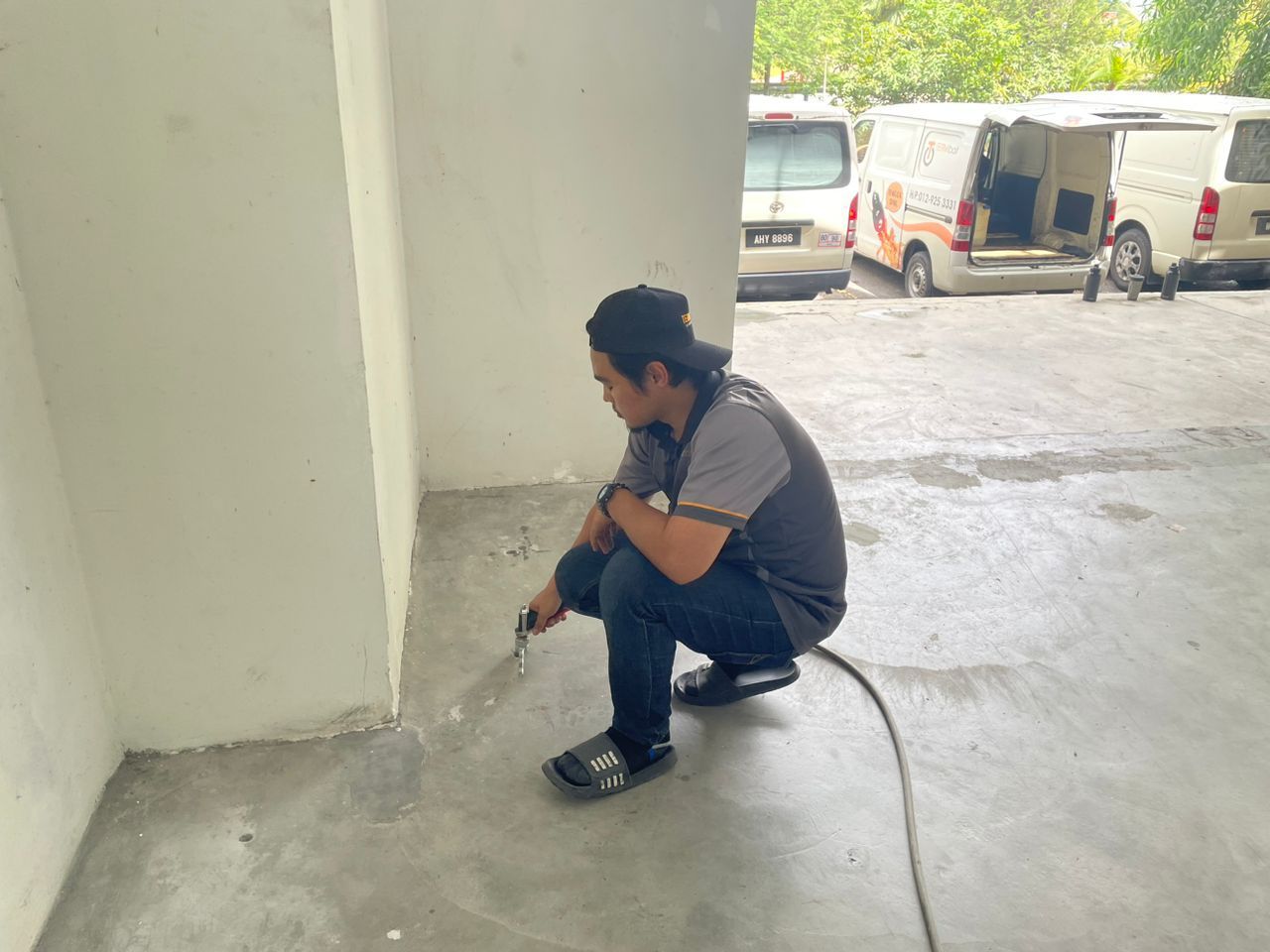 Anti termite - pumping chemical into the holes drilled on the ground