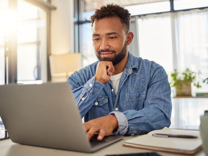 Photo of person typing on laptop - Pay Rent