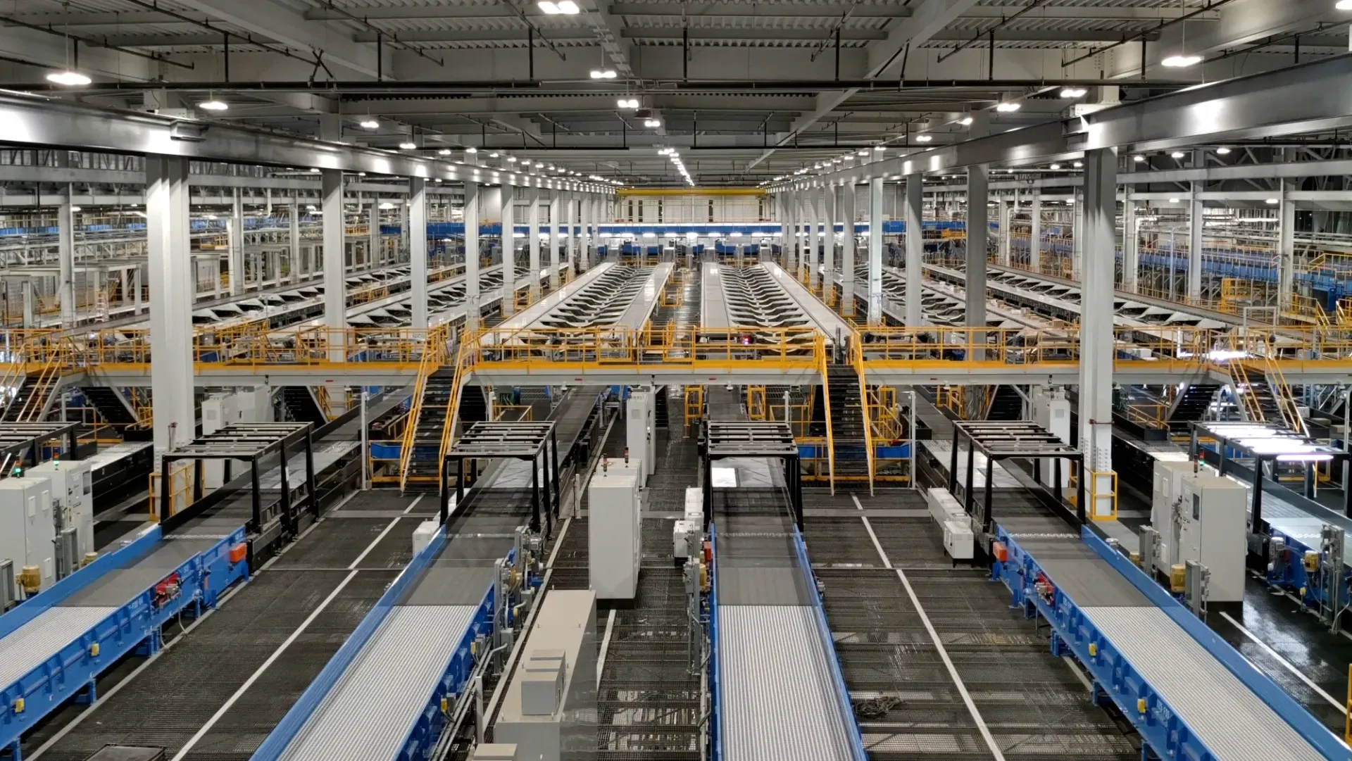 Factory interior with conveyor belts and machinery.