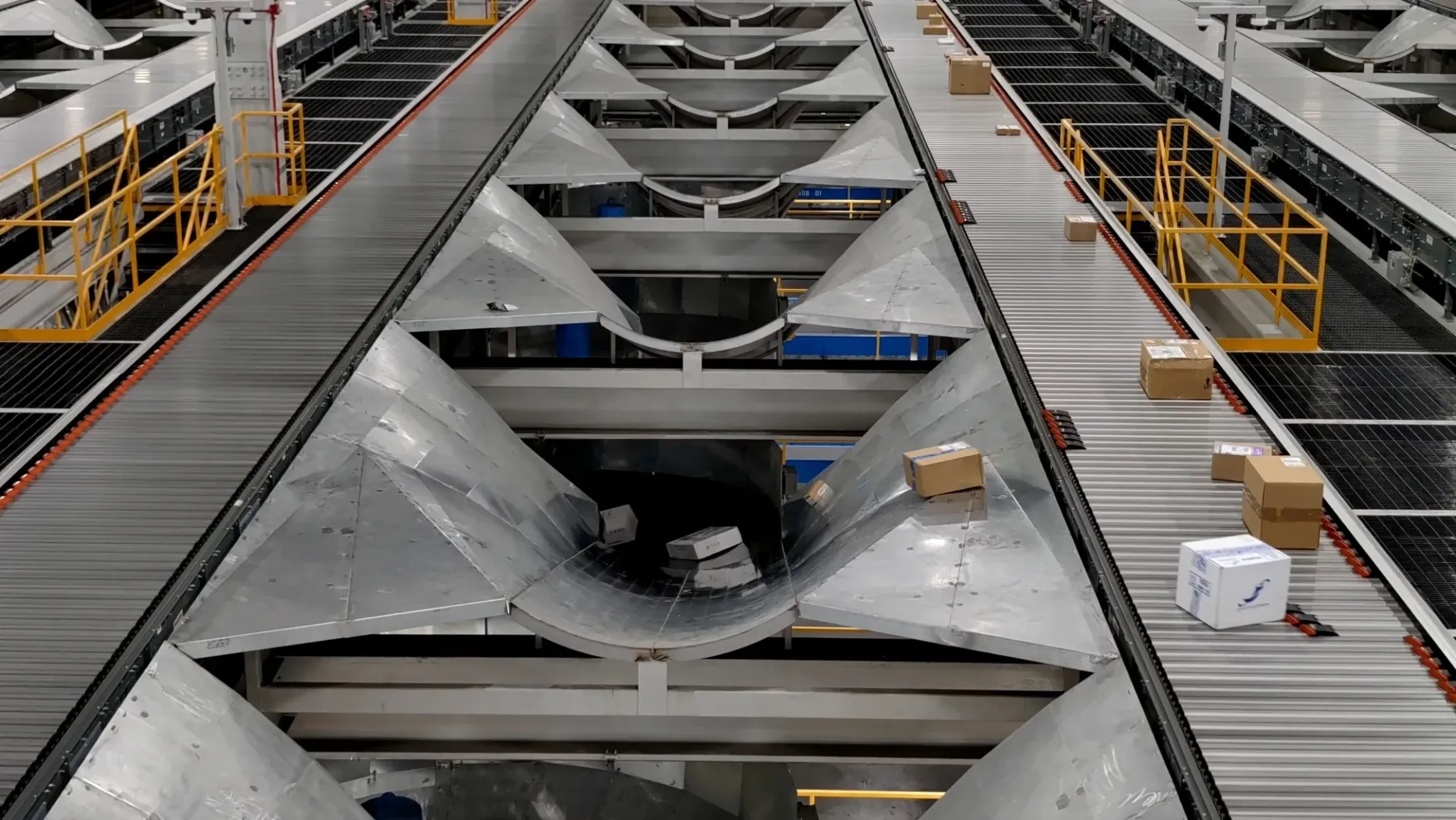 Conveyor belts in a warehouse sorting packages into designated areas.