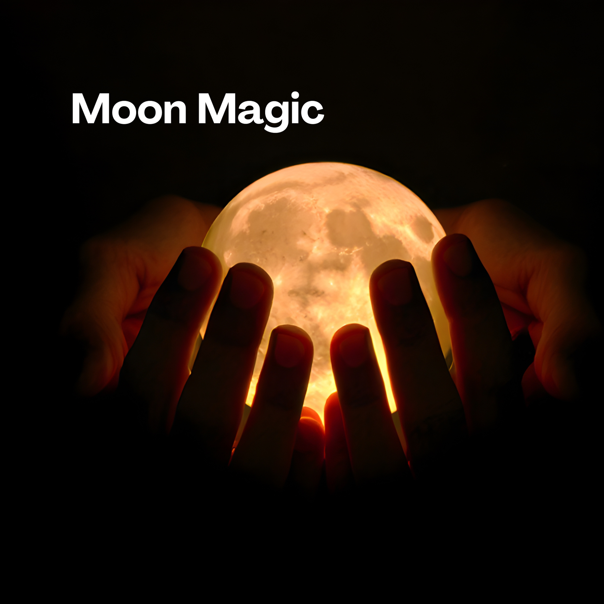 Image created to appear as if someone's hands are holding the full moon, with the words Moon Magic on the dark behind the illuminated moon