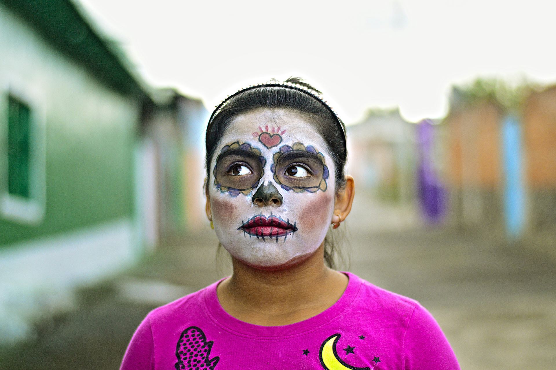 Meditate to relieve grief - smiling girl in photo with make up to honour the Day of the Dead celebration in Mexico