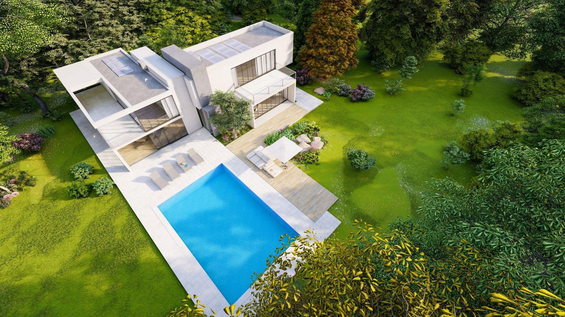 An aerial view of a modern house with a swimming pool surrounded by trees.