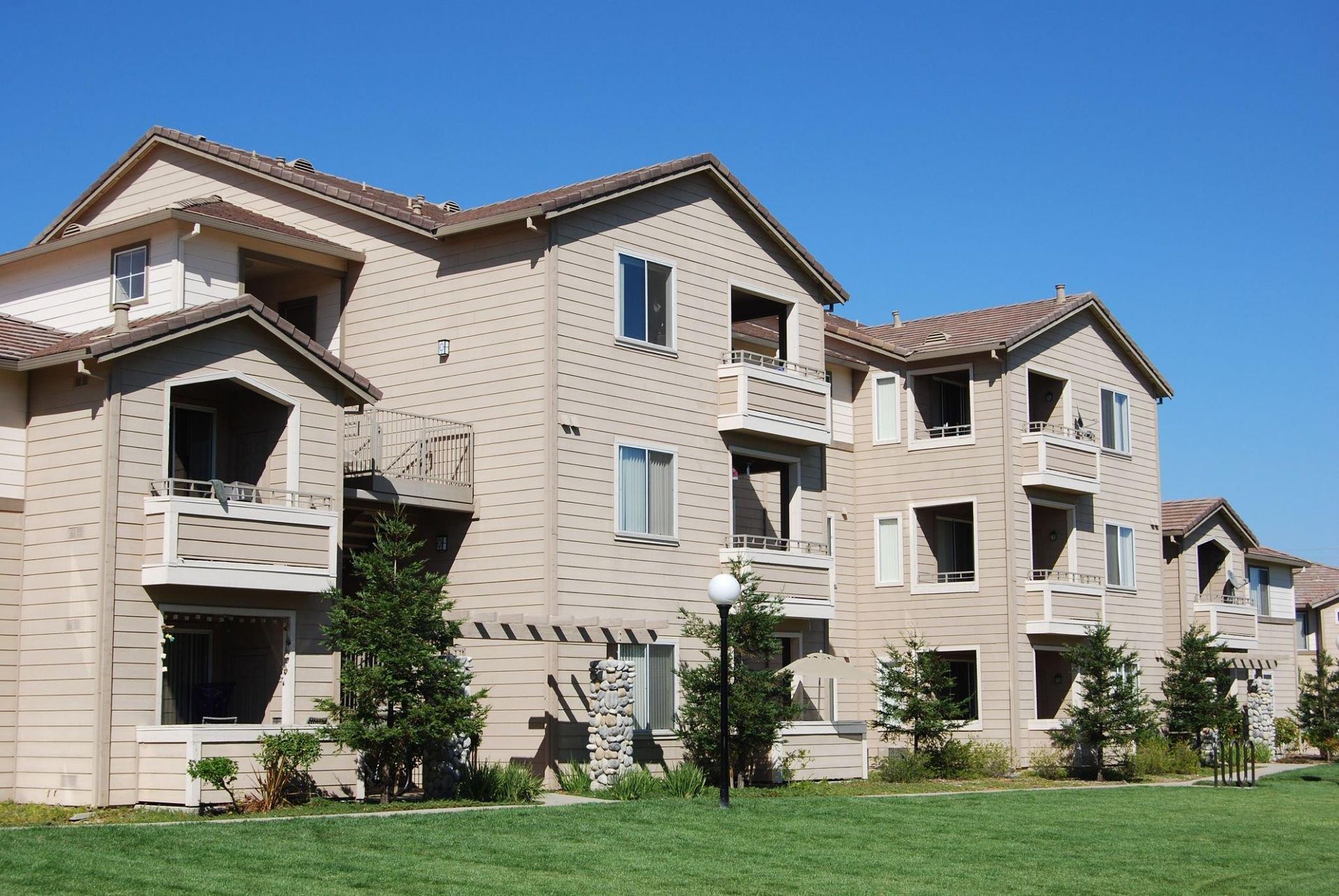 A large apartment building with a lot of windows and balconies