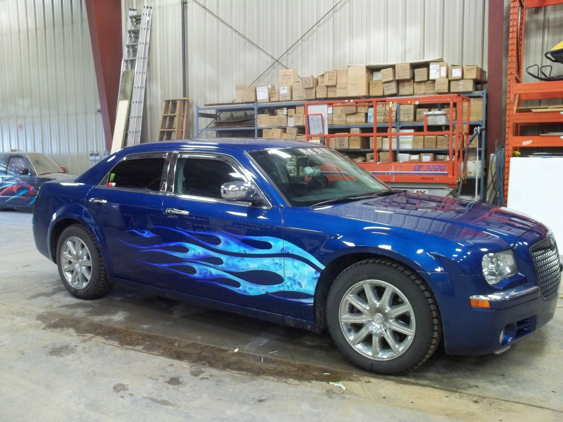 blue bentley with baby blue flame decals