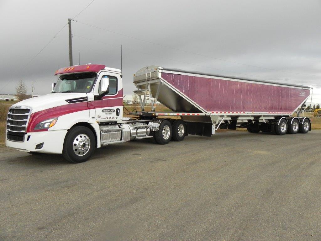 large white and pink cargo truck