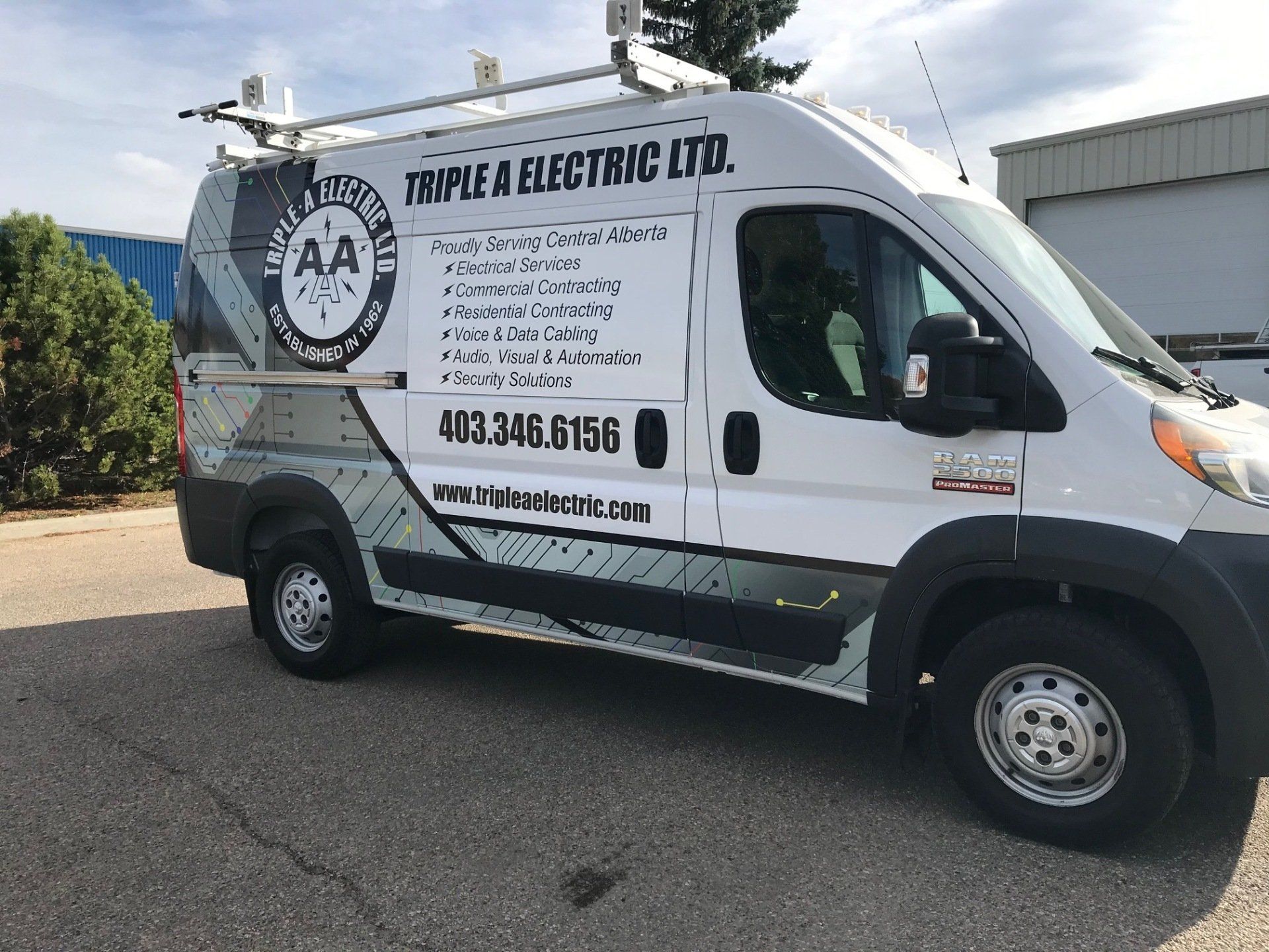 a white van is parked on the side of the road .