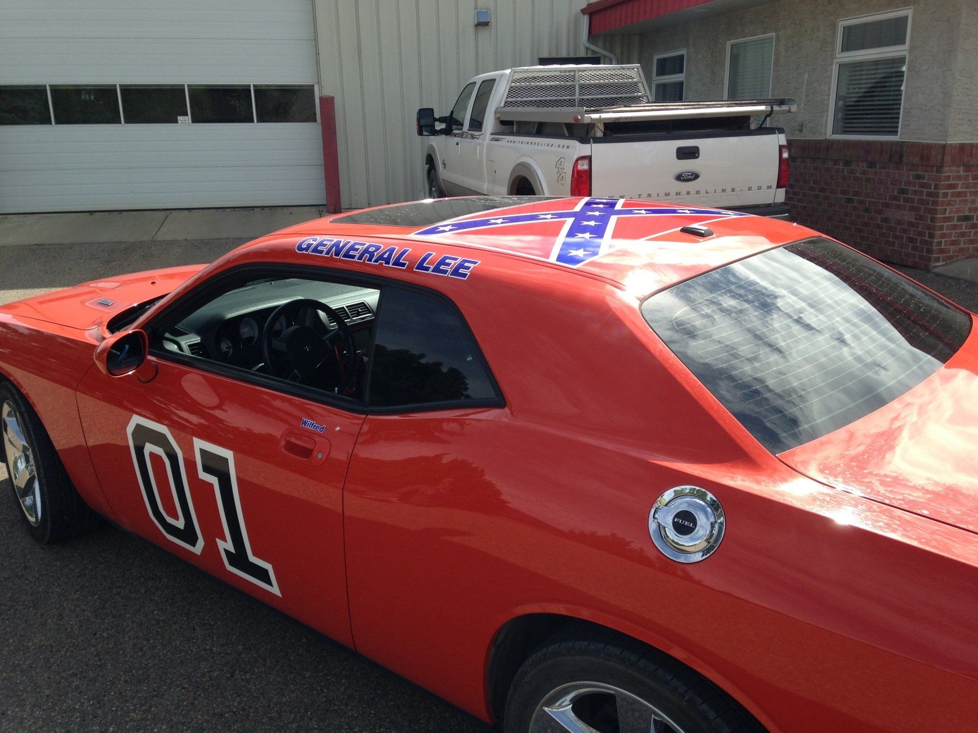 red muscle car with number one printed on the side