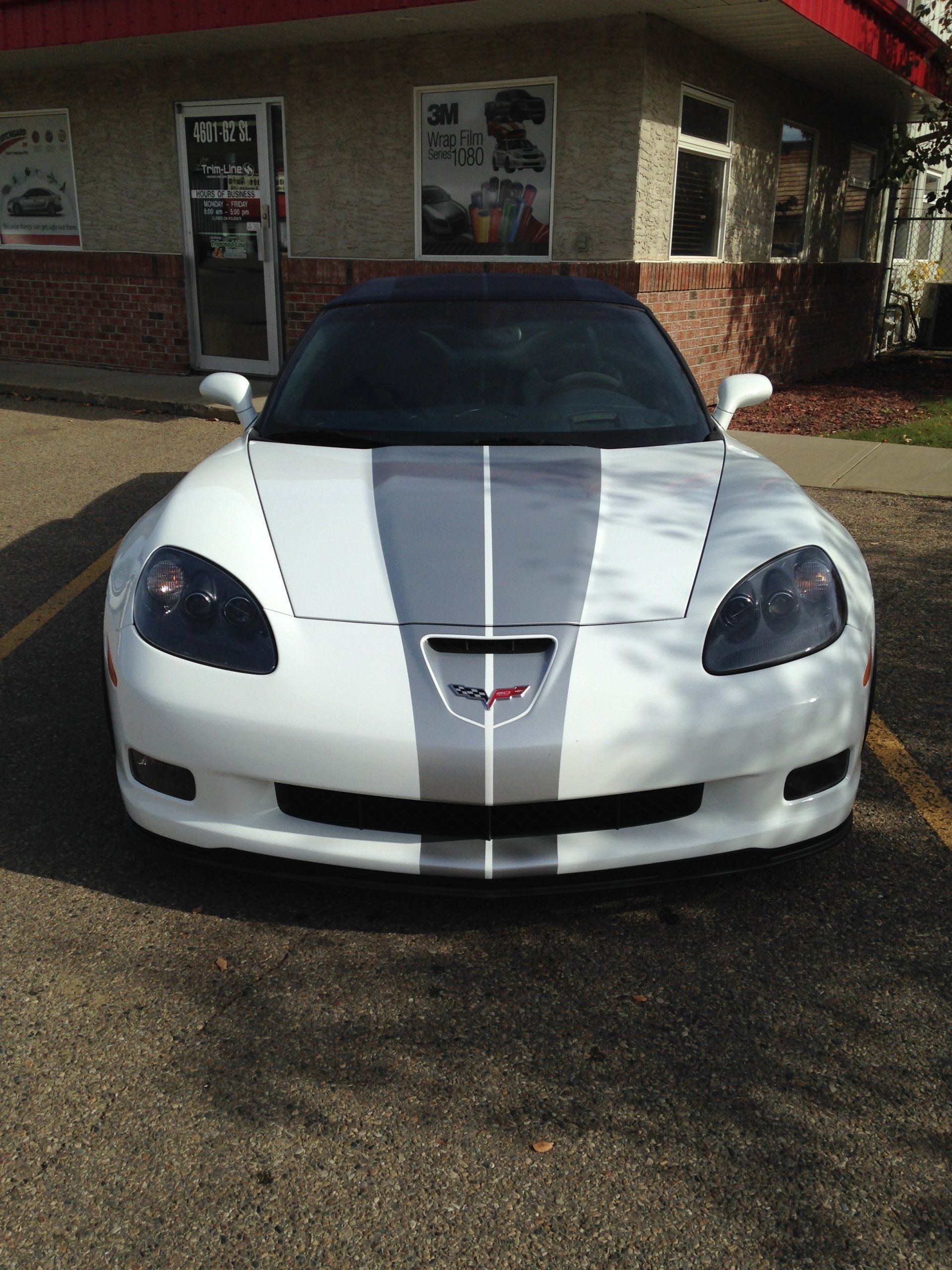sports car with grey racing stripe on it