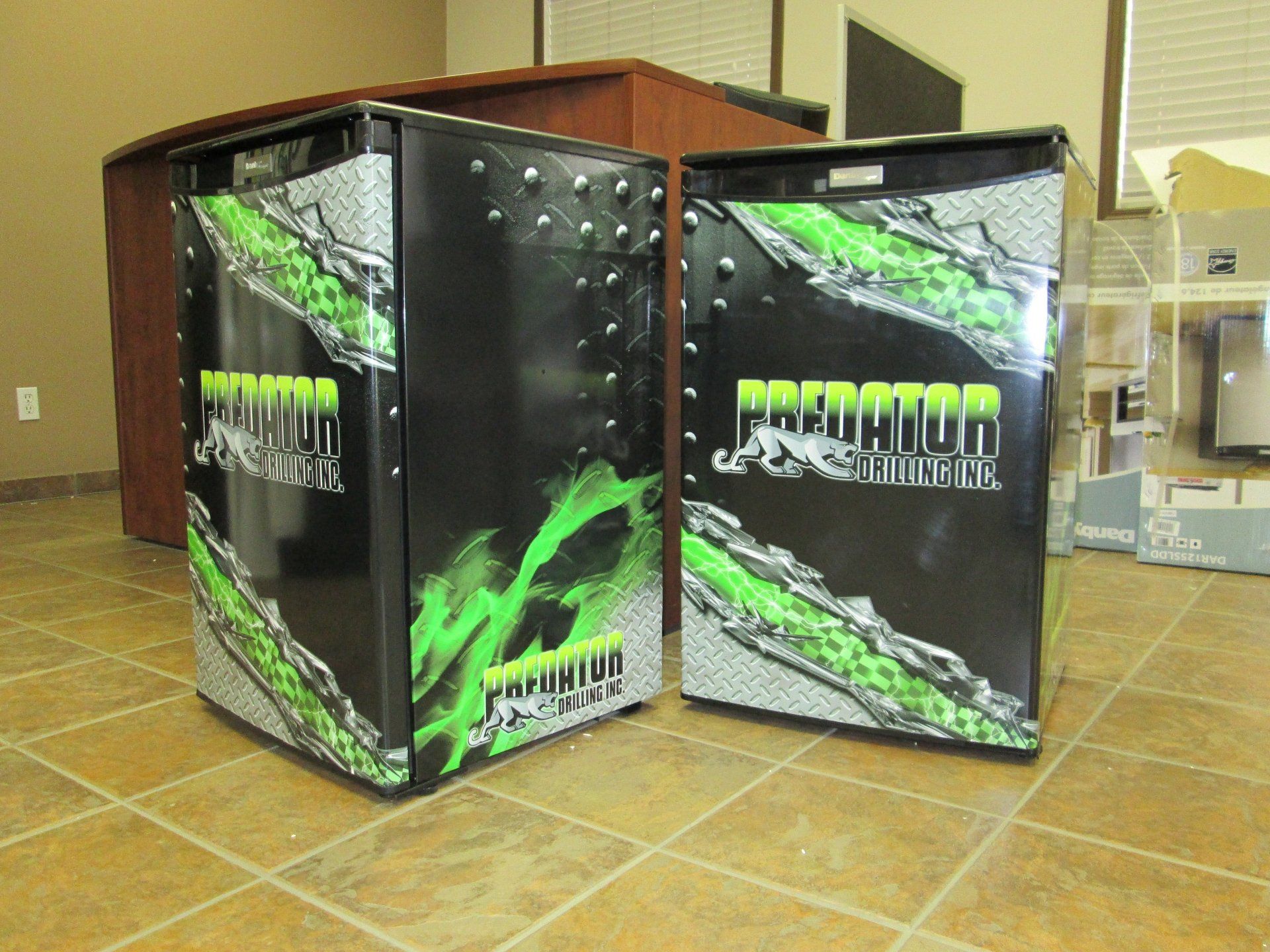 two small refrigerators with custom decal and logo
