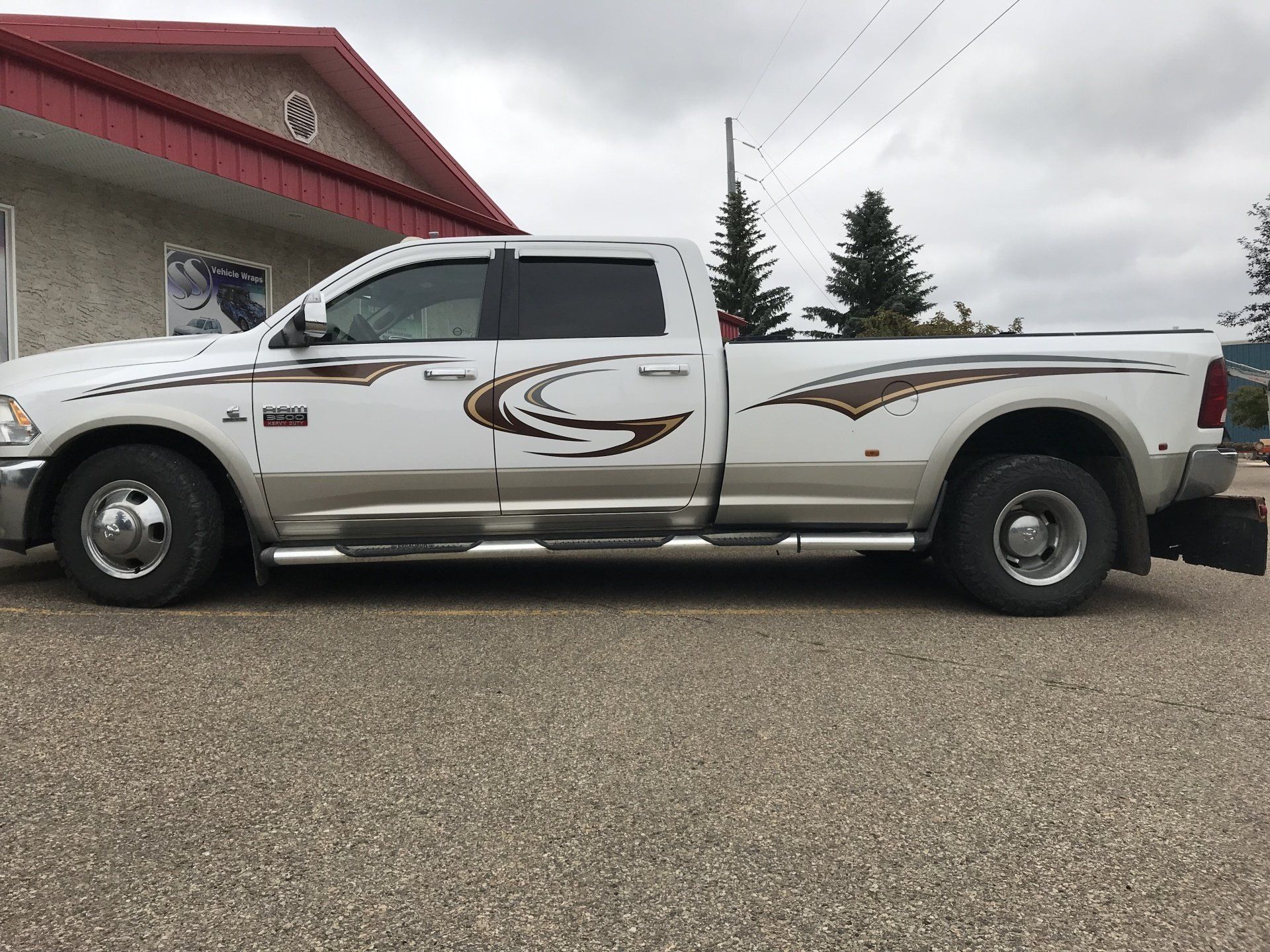 white truck with wavy decorative decals