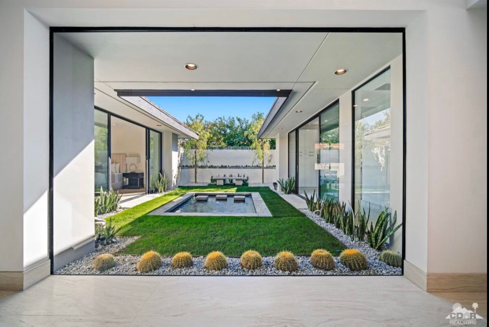 A house with a swimming pool in the middle of it