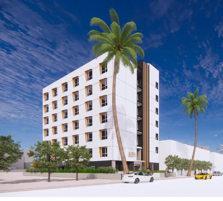 An artist 's impression of a building with palm trees in front of it.