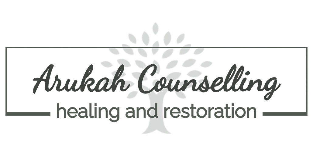 The logo for arukah counseling healing and restoration with a tree in the background.
