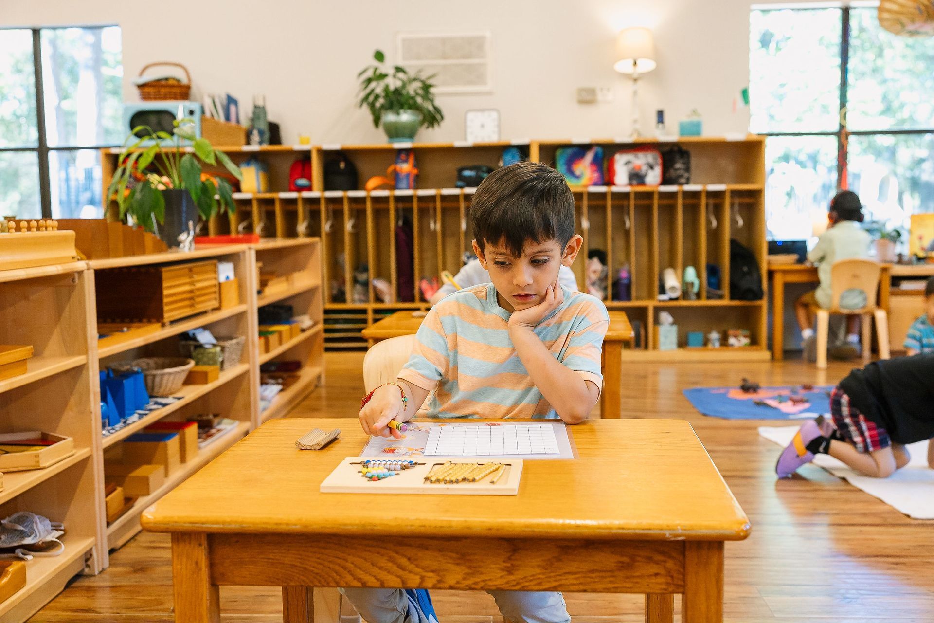 Montessori child working with materials