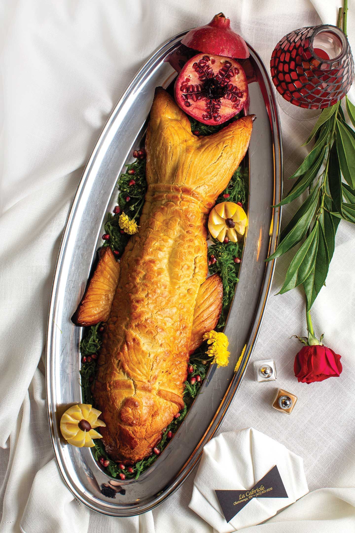 Grilled meat platter with side dishes: salad, fries, sauces