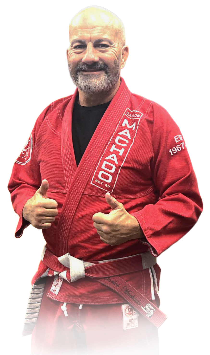 Man pointing, smiling, wearing black hoodie; arm tattoo visible.