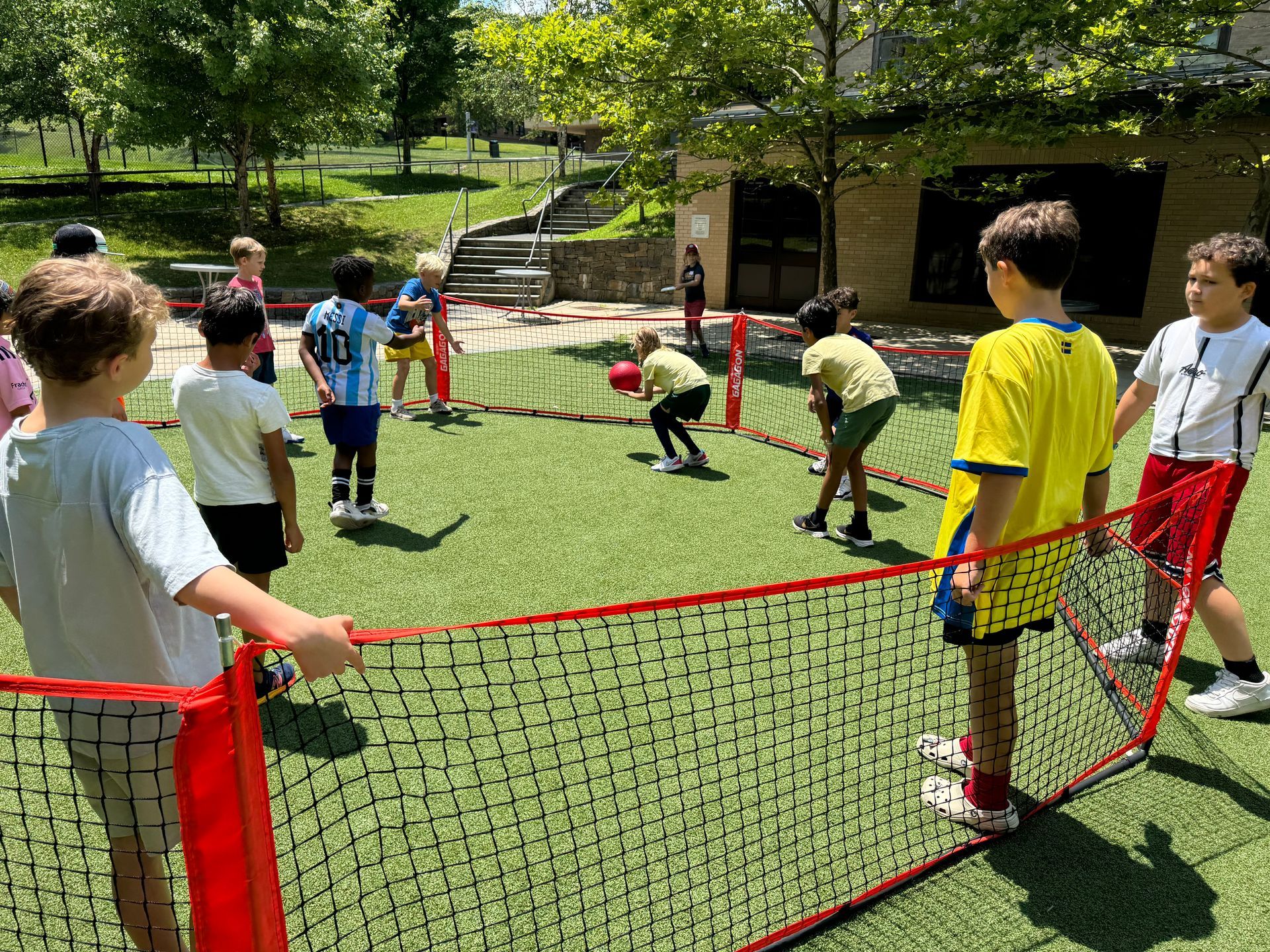 A boy in a yellow shirt with the number 10 on it