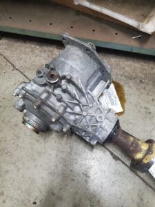 Silver car differential lying on a concrete surface. | Joe's Slinger Service