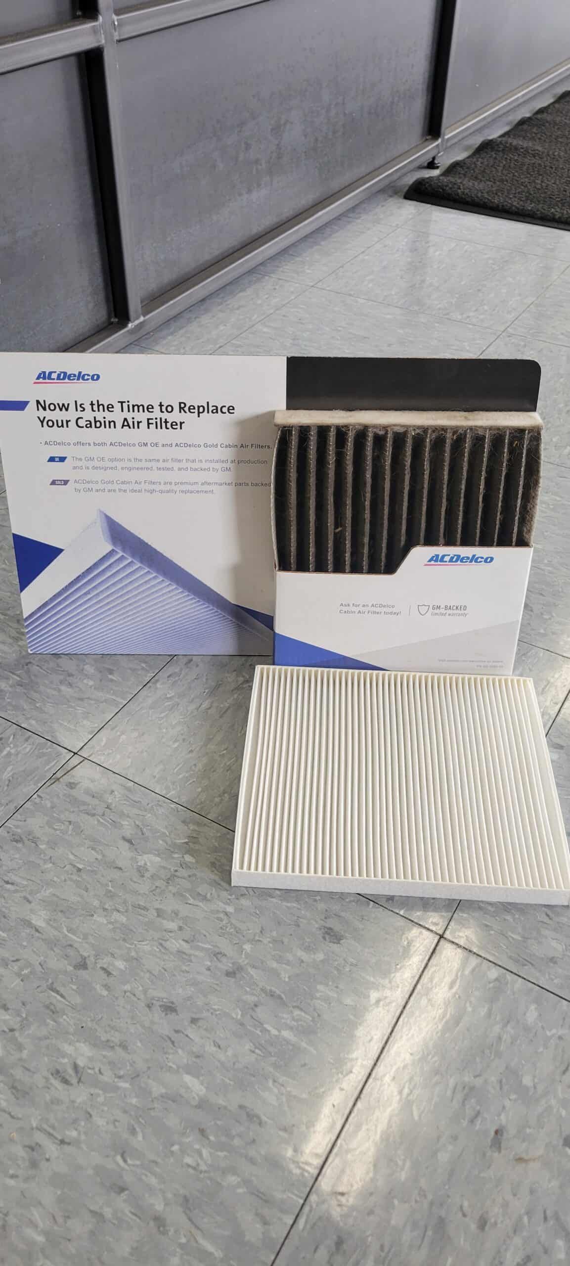 Car air filter and box on a tiled floor. | Joe's Slinger Service