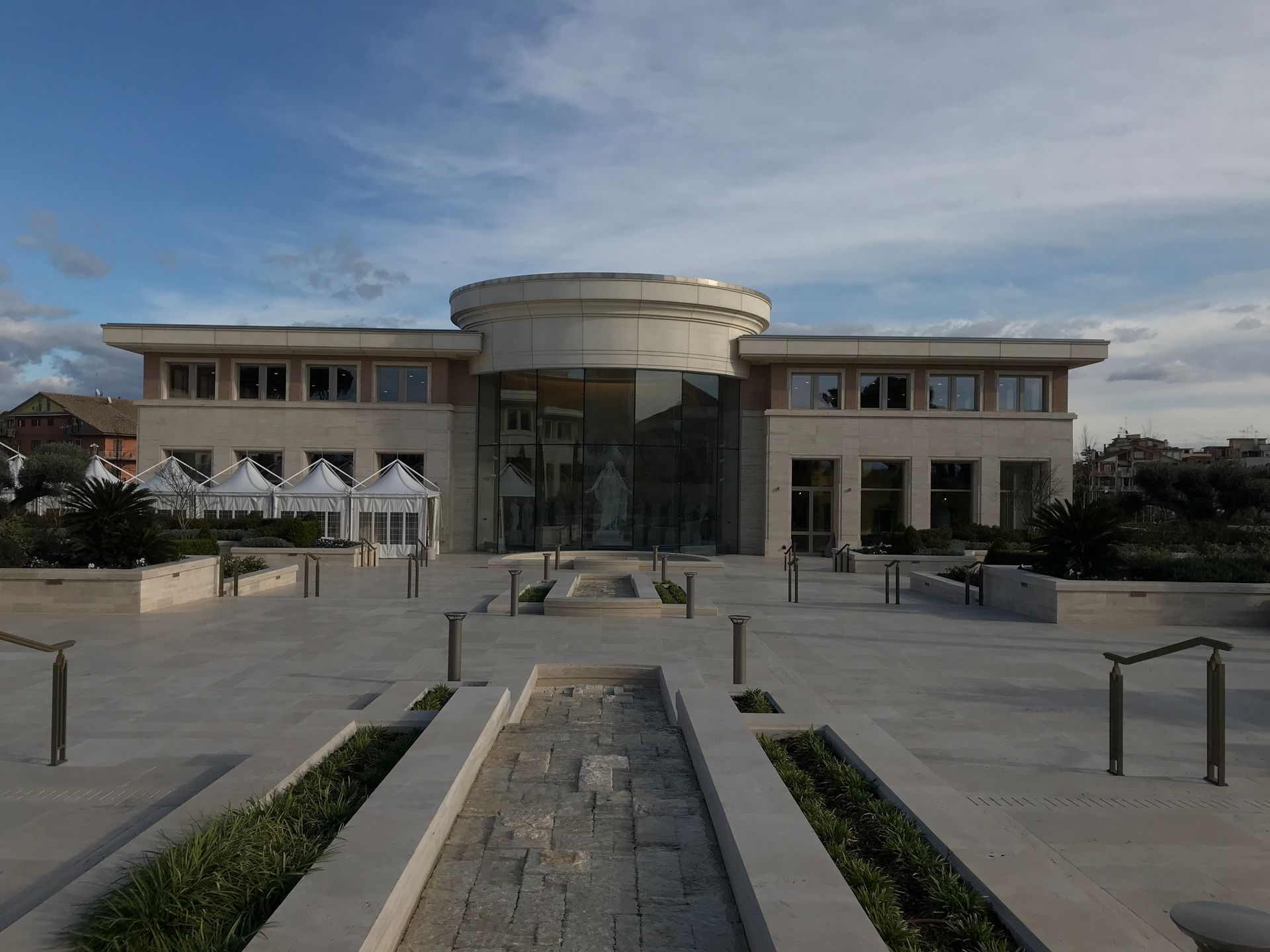 A large building with a fountain in front of it