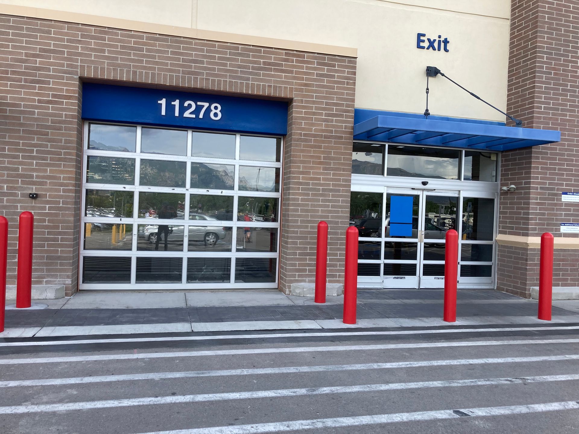 A store with a blue sign that says exit on it