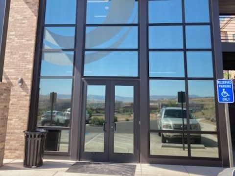 A building with a handicapped parking sign in front of it