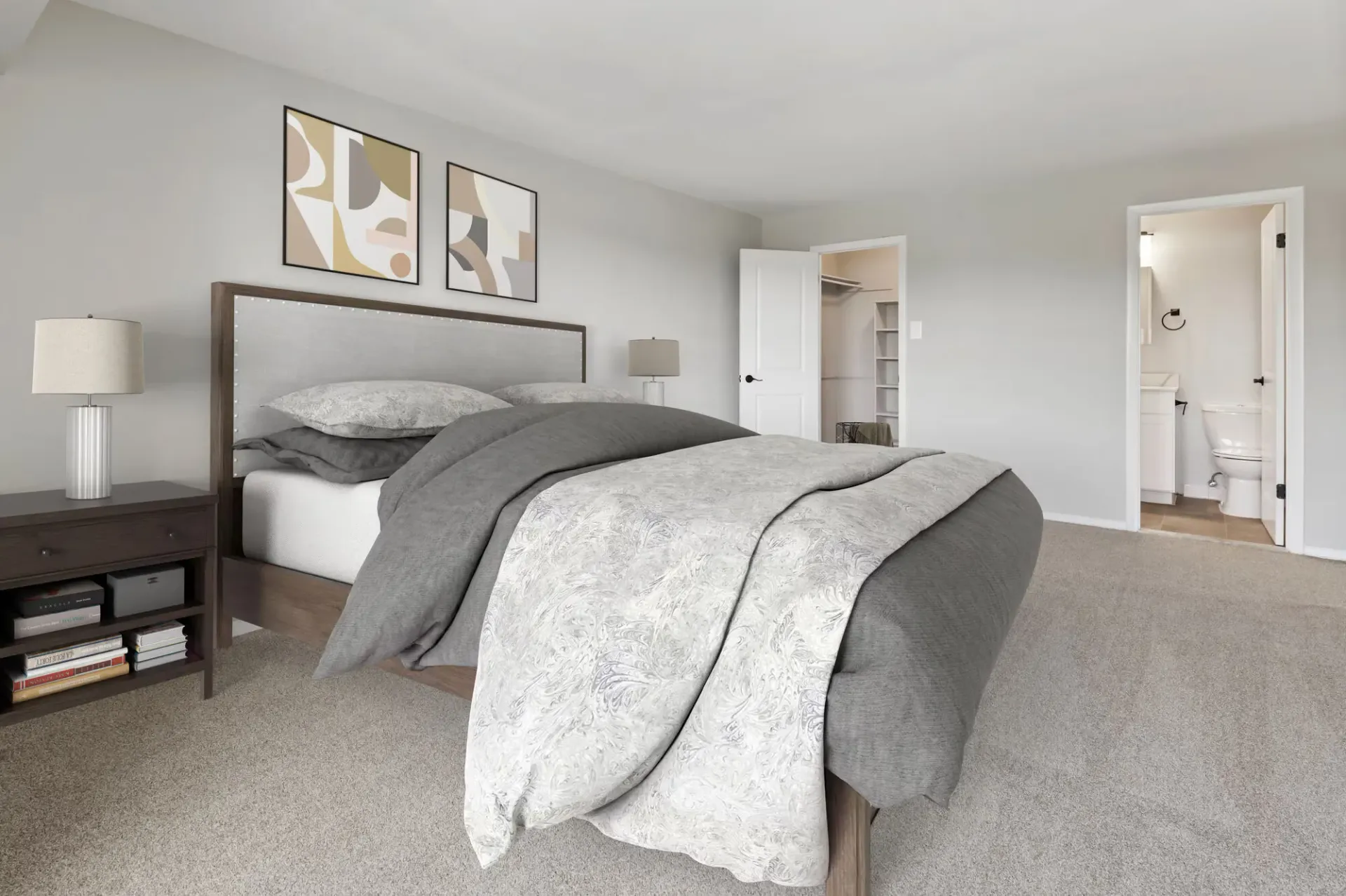 Bedroom with a large bed, two nightstands, and open doors to a closet and bathroom.