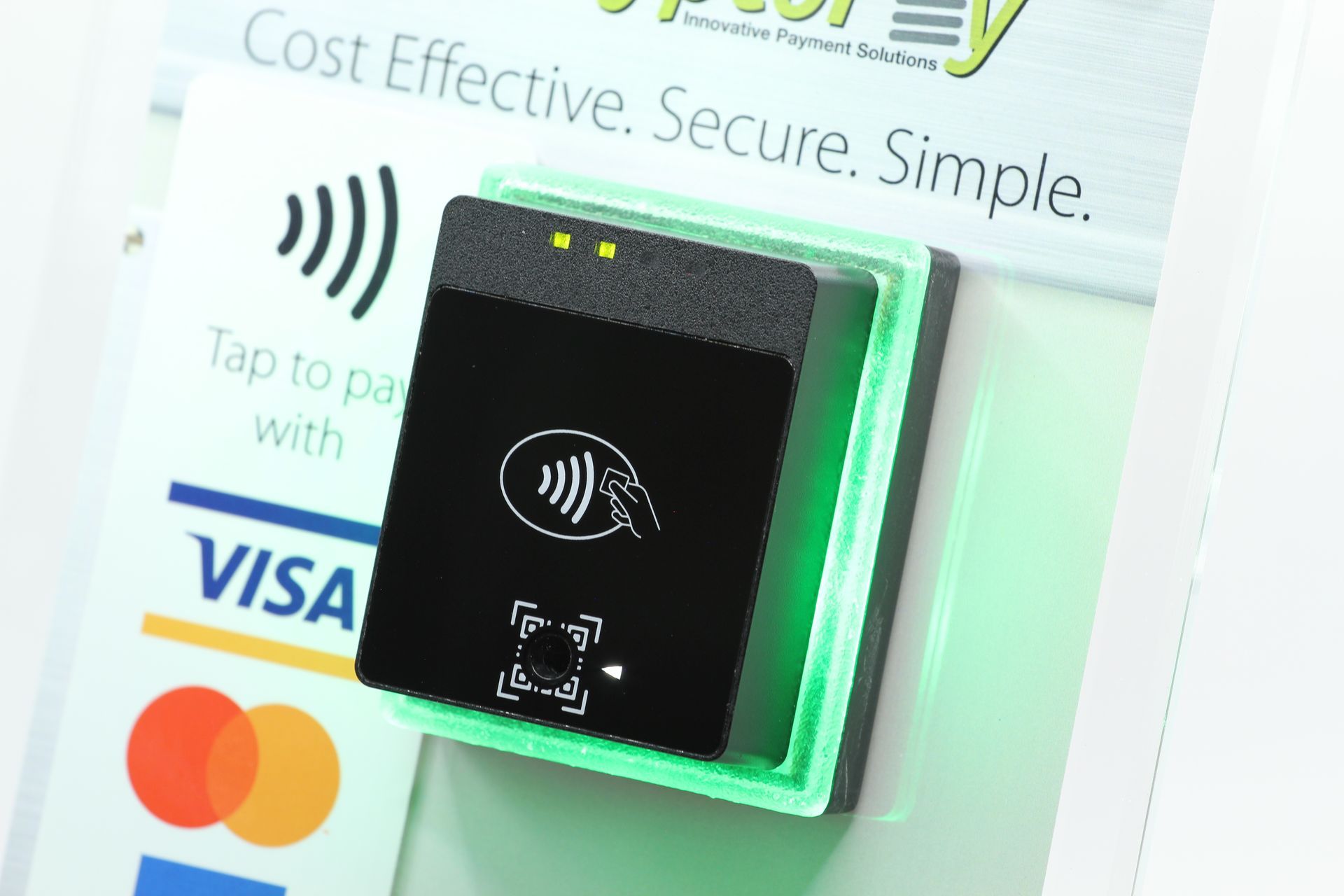 A contactless payment terminal, with the Visa logo, and the words 