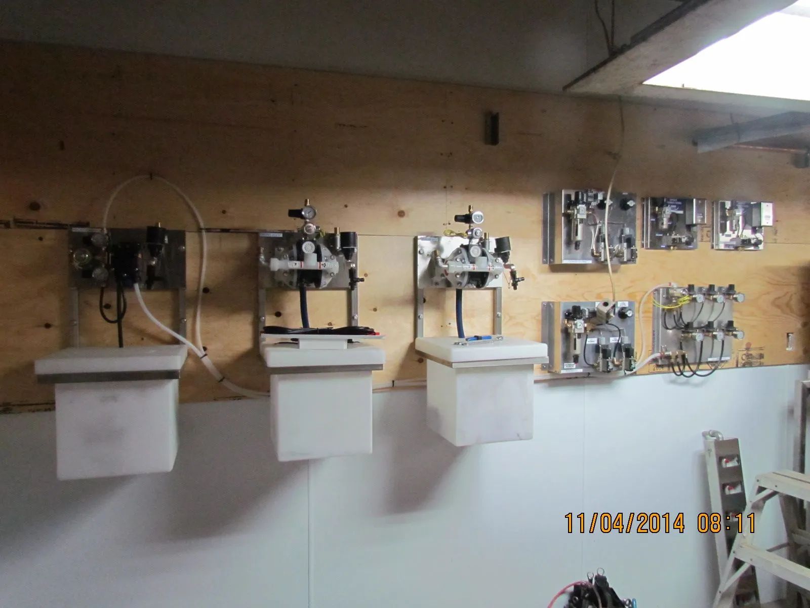 A photo taken on november 14 2014 shows a row of white containers hanging on a wall