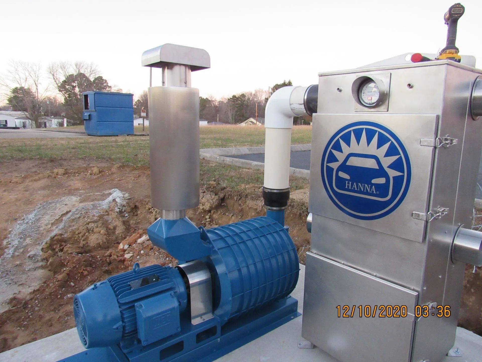 A stainless steel machine with a car logo on it