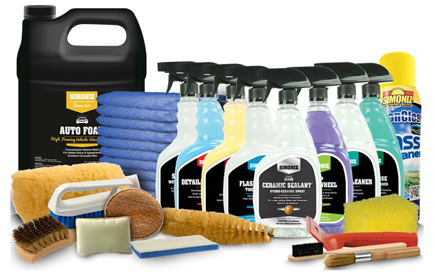 A bunch of cleaning supplies including a bottle of auto polish