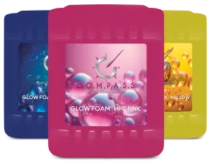 Three colorful cleaning product containers with labels. The center one is pink and says 