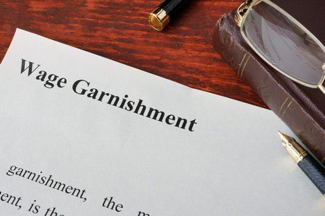 Wage Garnishment Definition Written On A Paper — Oakland, CA — Claude D Ames Attorney At Law