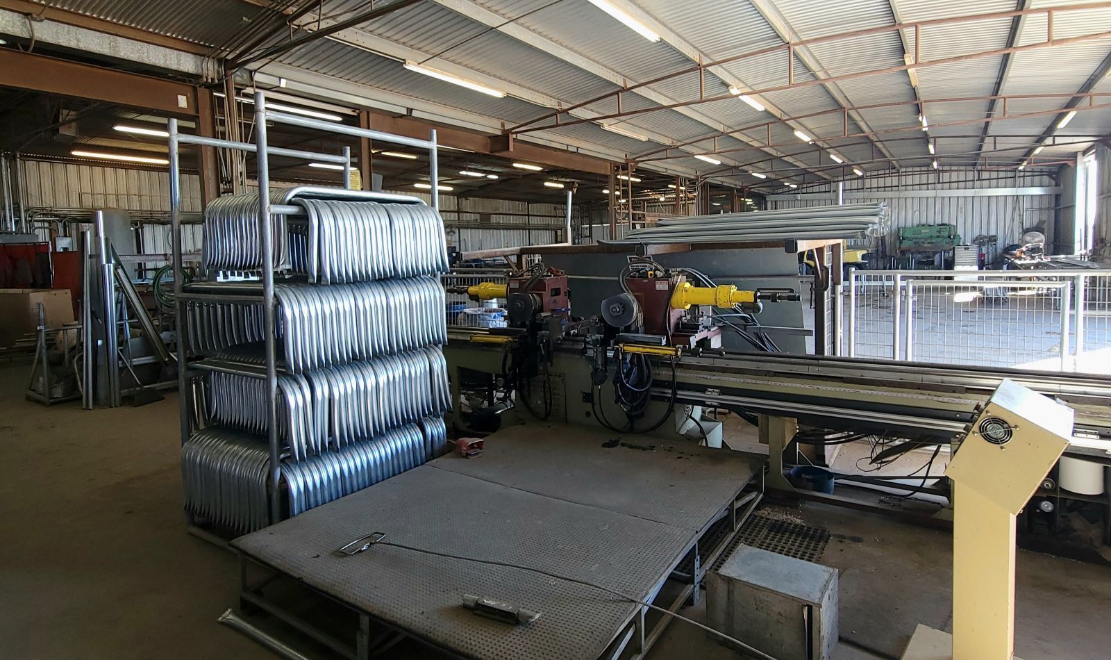 A large warehouse filled with lots of machinery and tires.