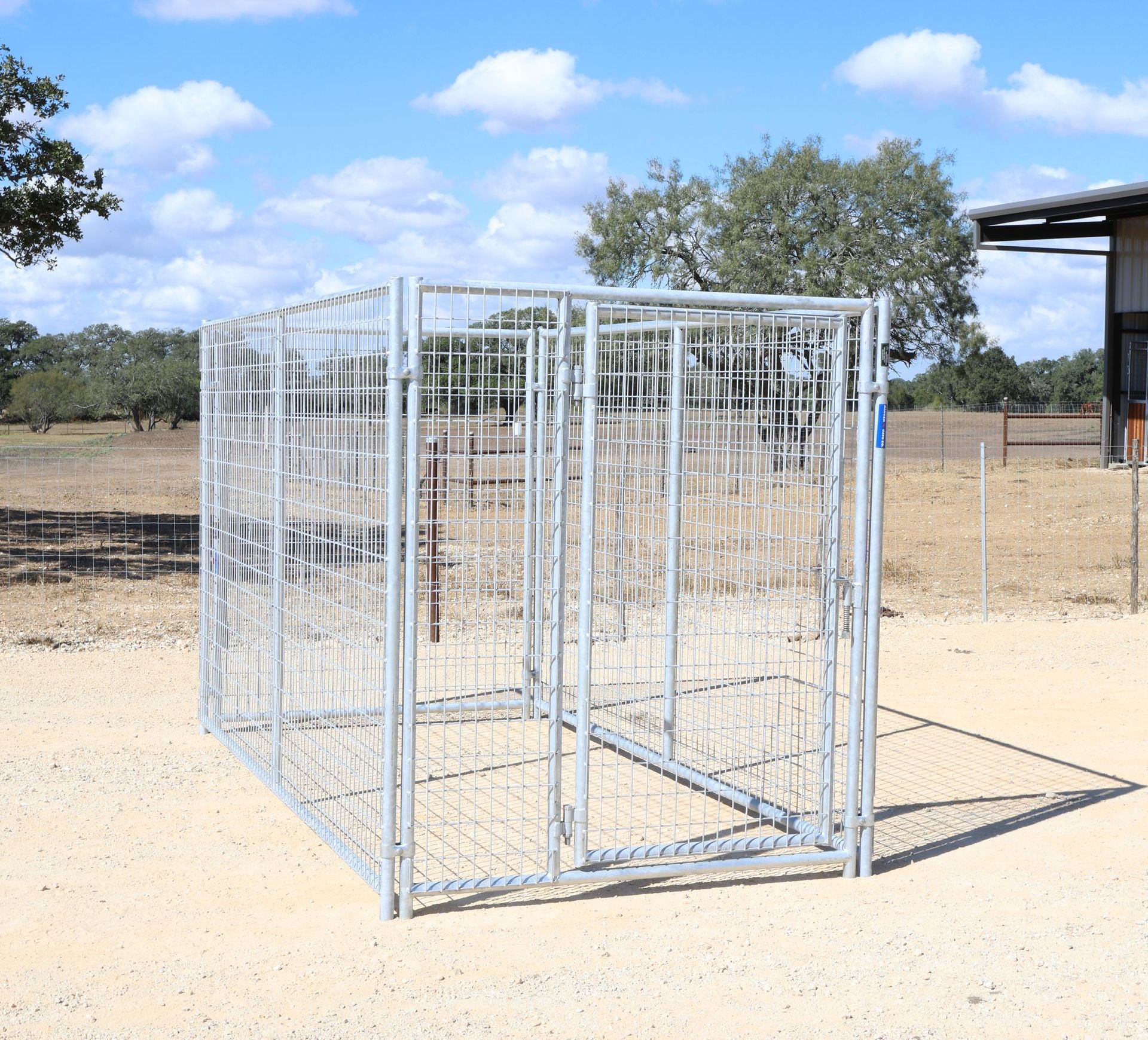A fenced in area with a building in the background