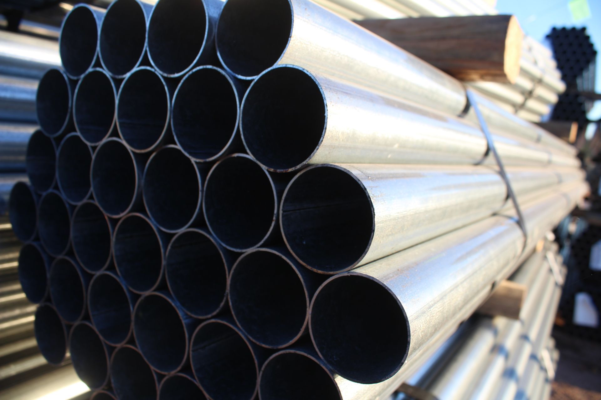 A bunch of metal pipes stacked on top of each other