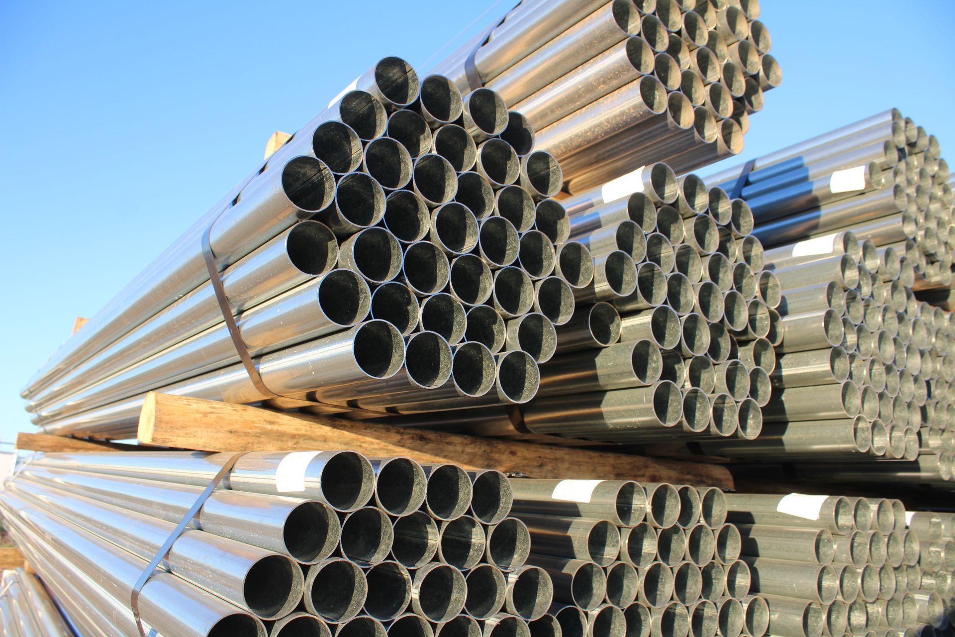 A bunch of metal pipes stacked on top of each other