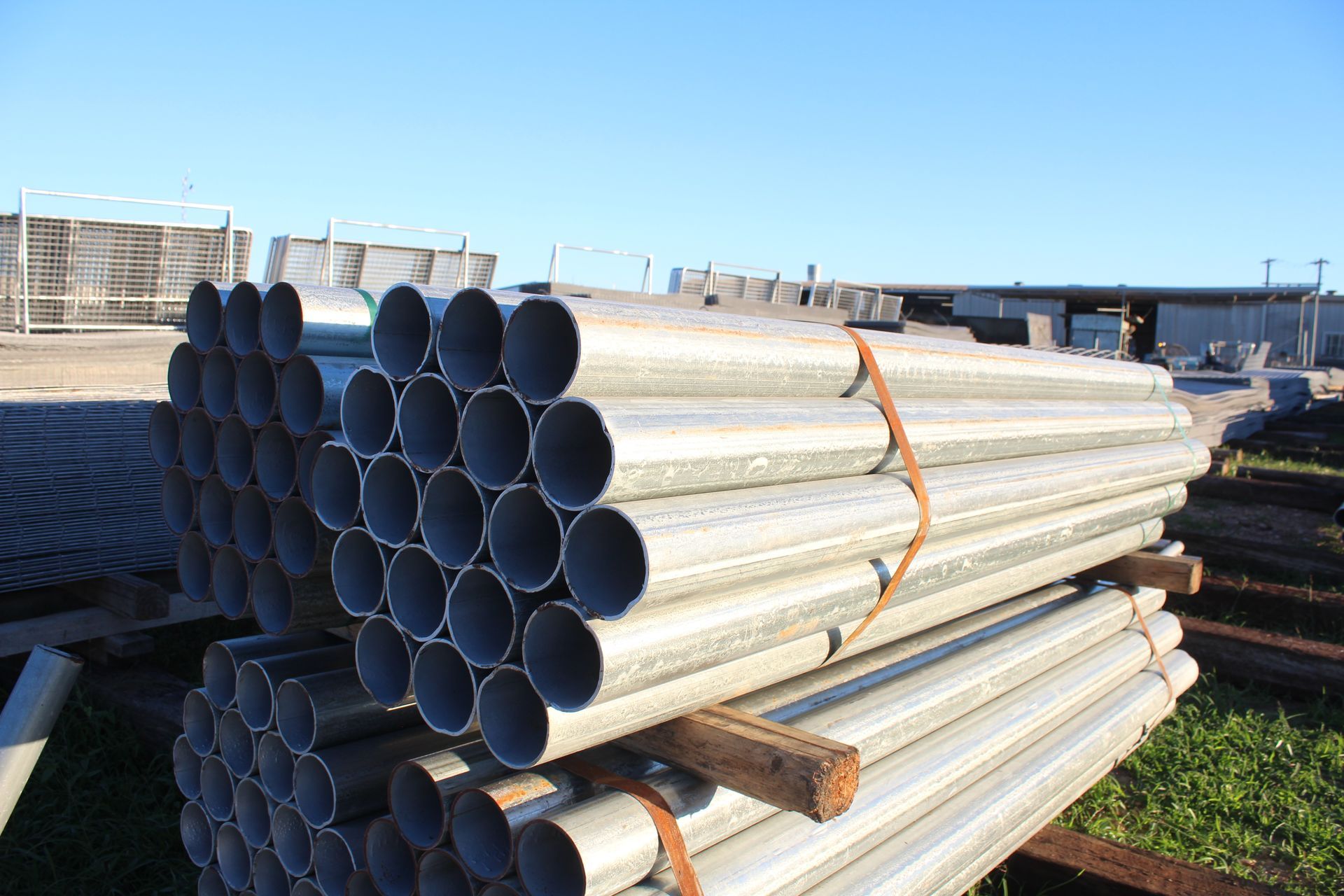 A bunch of metal pipes stacked on top of each other