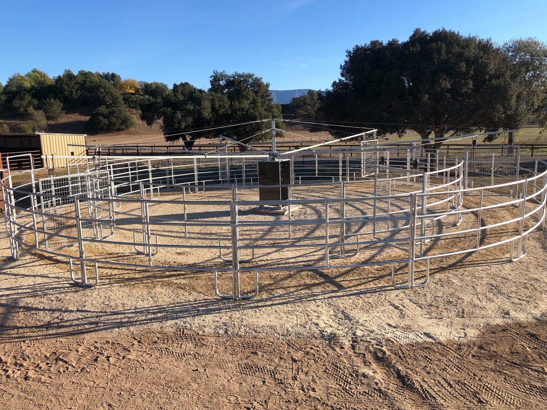 A fenced in area with trees in the background