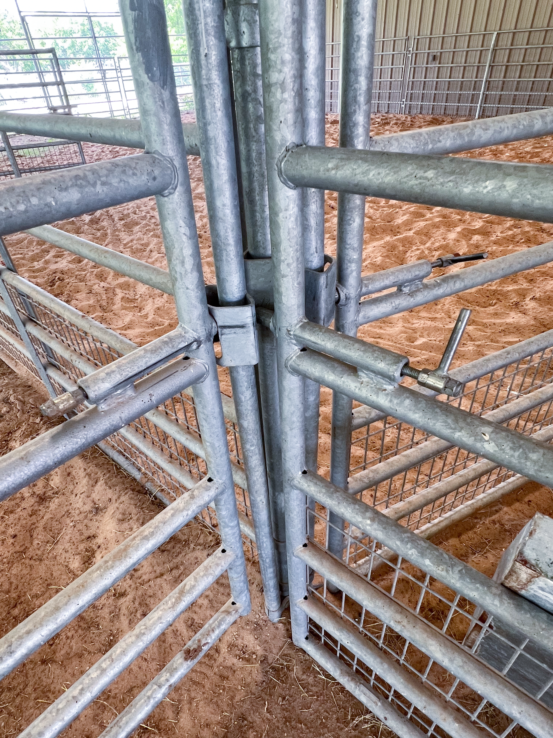 A close up of a metal fence in a barn.