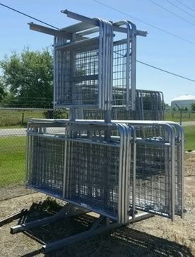 A bunch of metal fences are stacked on top of each other