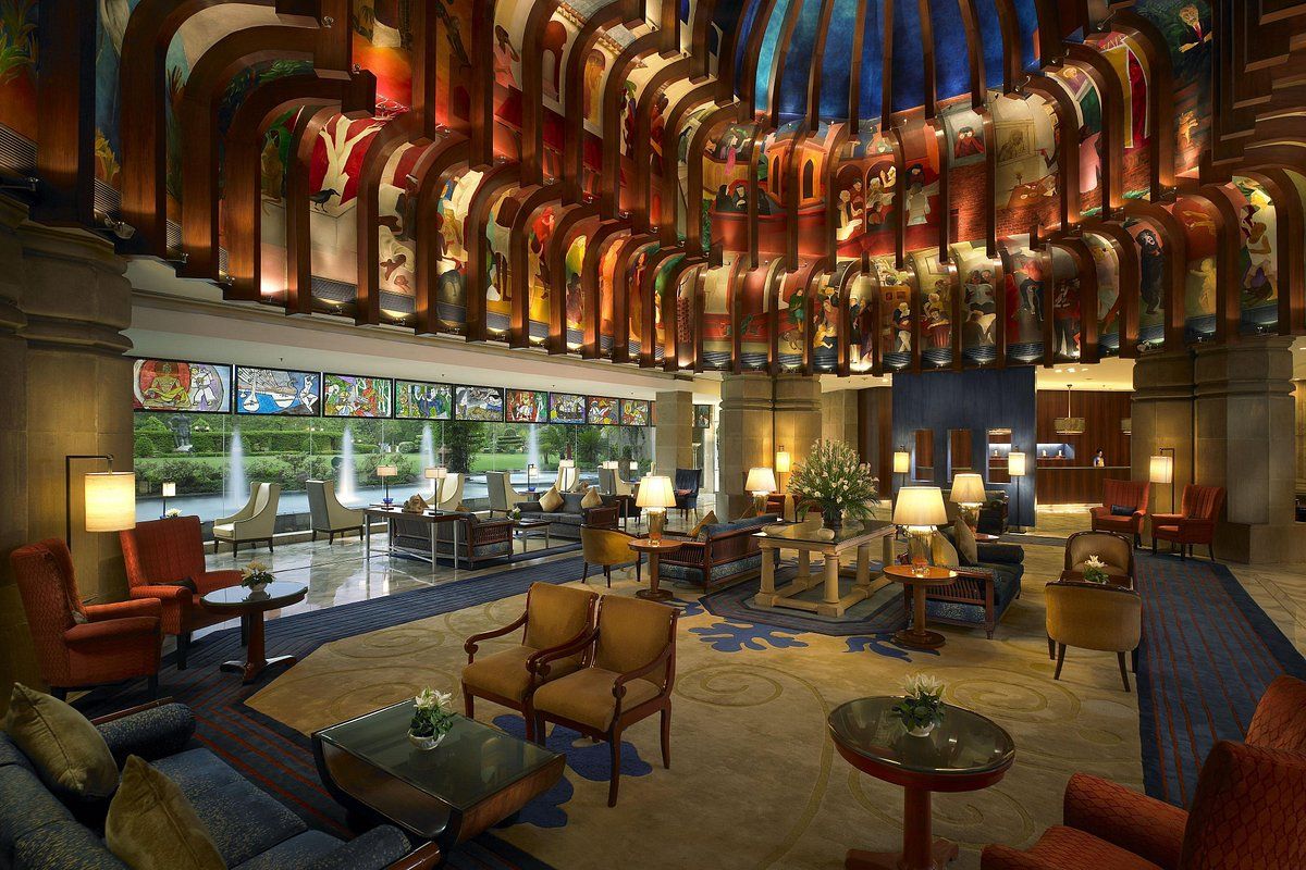 An artist 's impression of the lobby of a hotel.