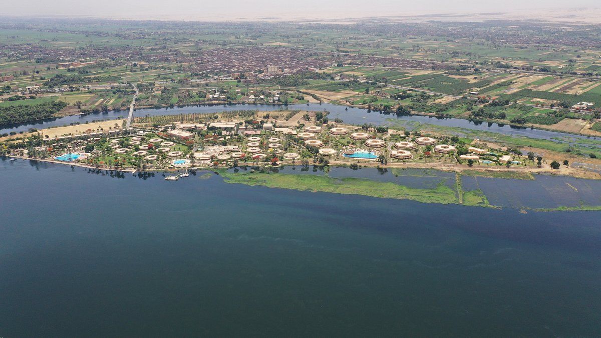 An aerial view of a small island in the middle of a large body of water.