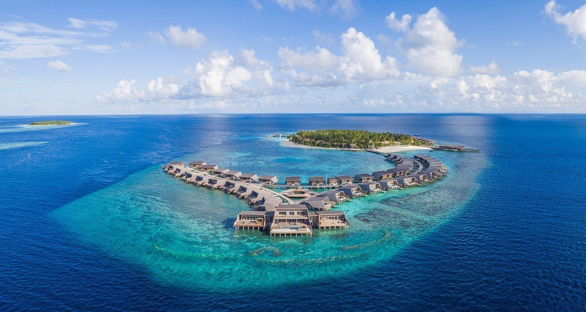 An aerial view of a small island in the middle of the ocean.