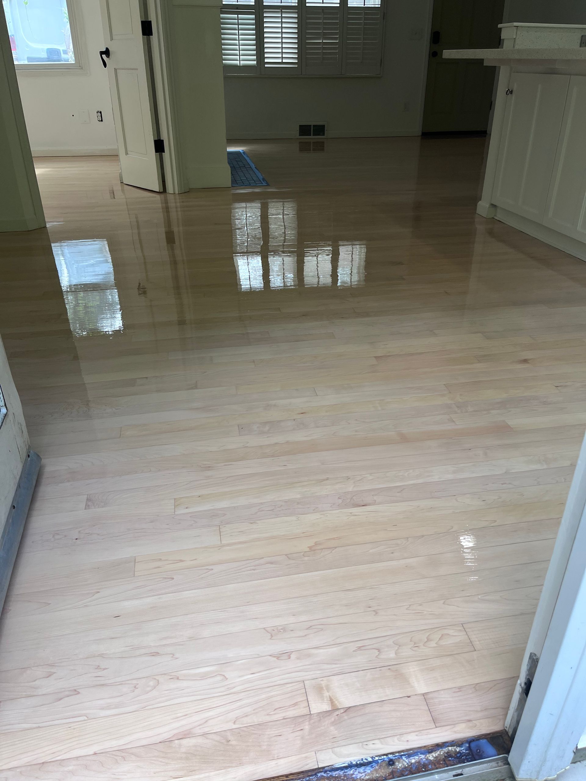 There is a wooden floor in the middle of the room.