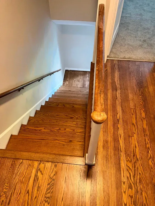 A wooden staircase leading up to the second floor of a house.