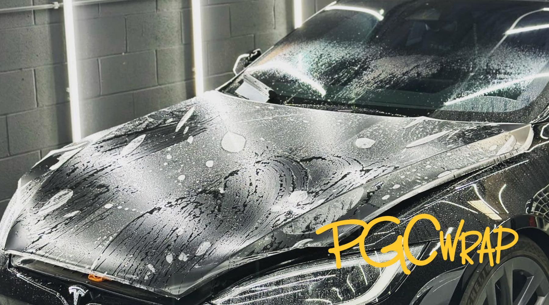 Tesla undergoing a paint protection film application at PGC Wrap.