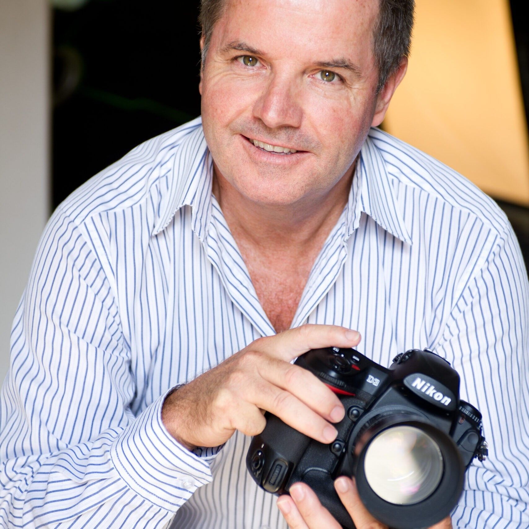 Terry Rogan holding camera