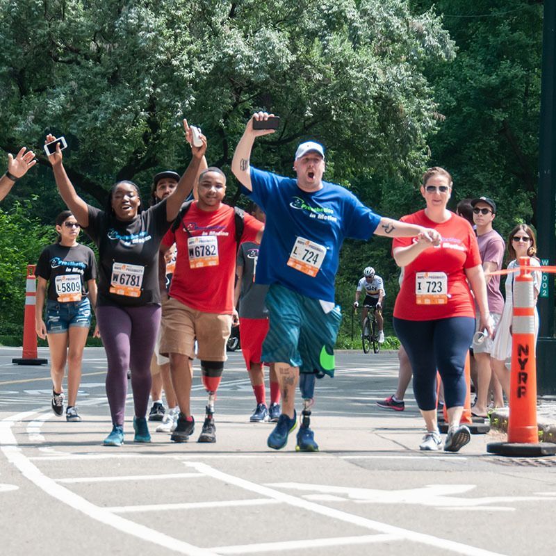 A group of people are running a marathon and one of them has the number 728 on his shirt
